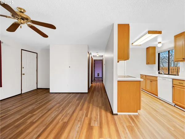 a view of a kitchen with wooden floor