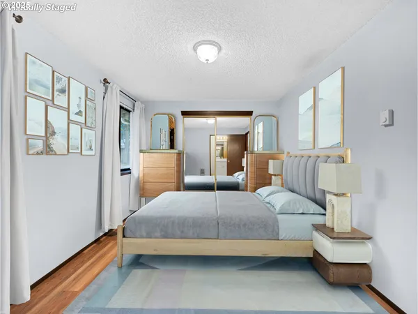 a bedroom with a bed and lamp