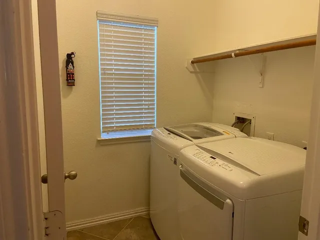 a utility room with a washer and dryer