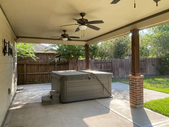 a view of patio with a table and chairs