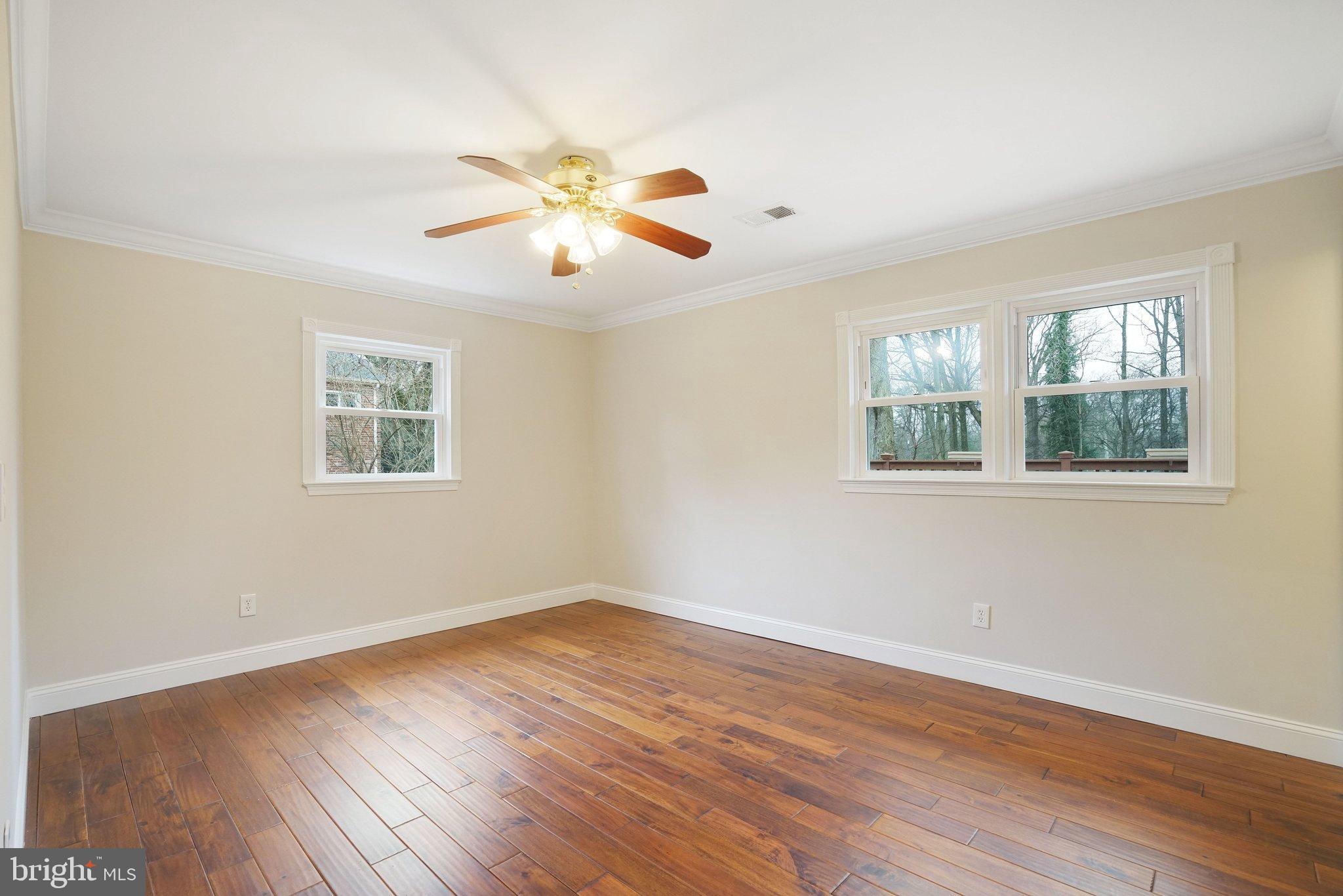 3412 Knox Road Annandale, VA 22003 - Photo 21 of 54 a view of an empty room with wooden floor and a window