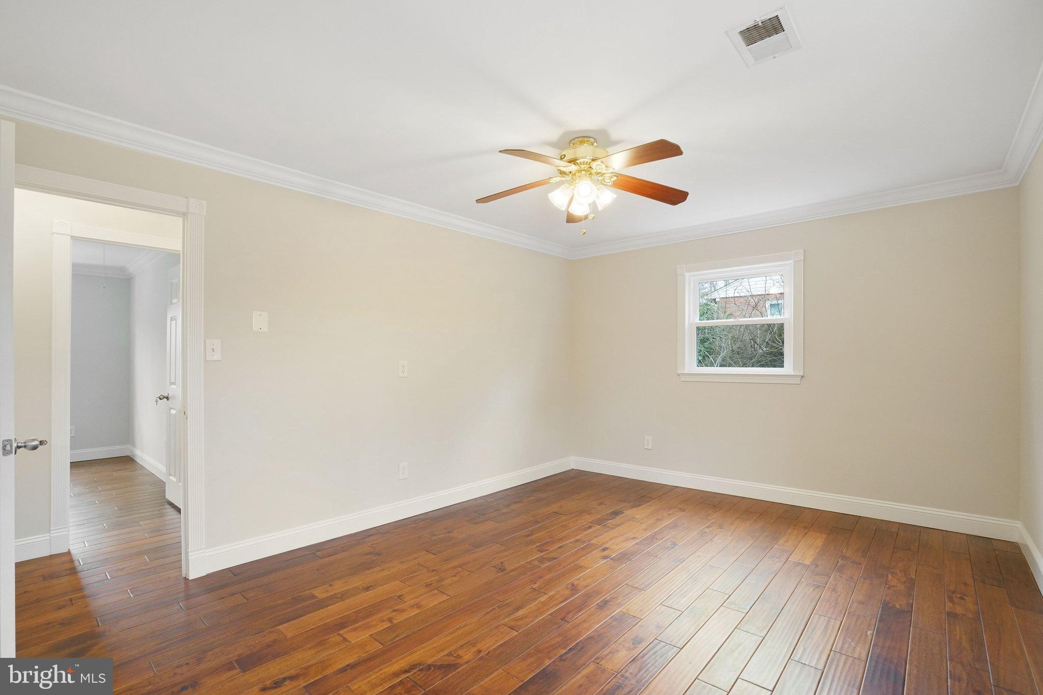 3412 Knox Road Annandale, VA 22003 - Photo 22 of 54 an empty room with wooden floor and windows