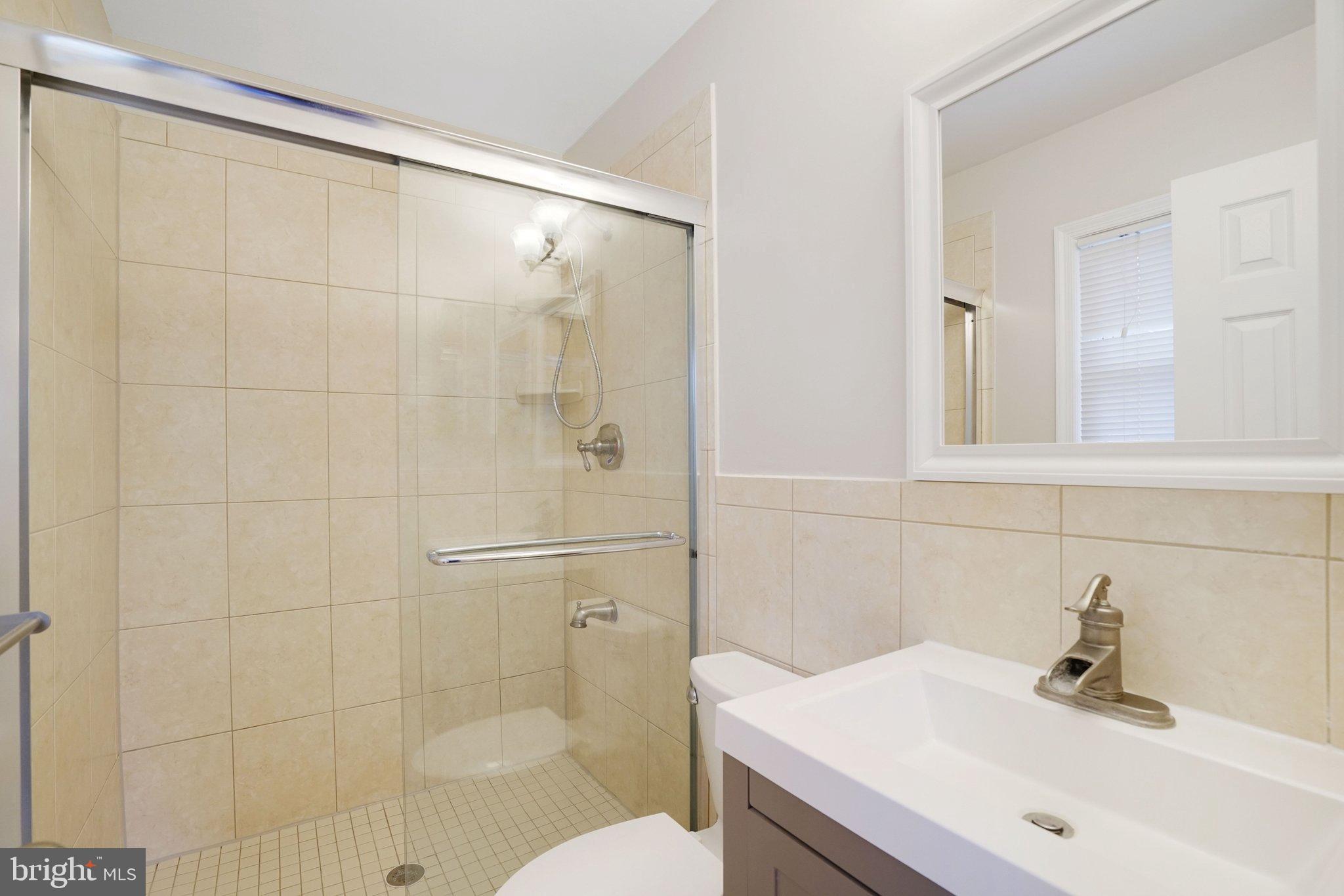 3412 Knox Road Annandale, VA 22003 - Photo 23 of 54 a bathroom with a sink toilet and shower