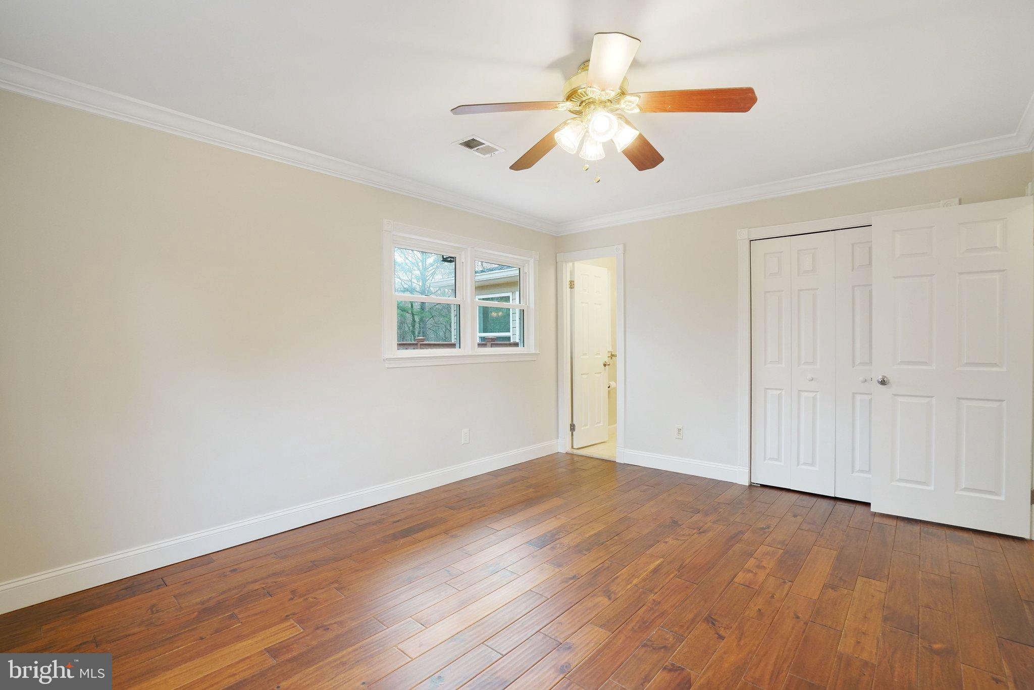 3412 Knox Road Annandale, VA 22003 - Photo 25 of 54 a view of an empty room with wooden floor and a window