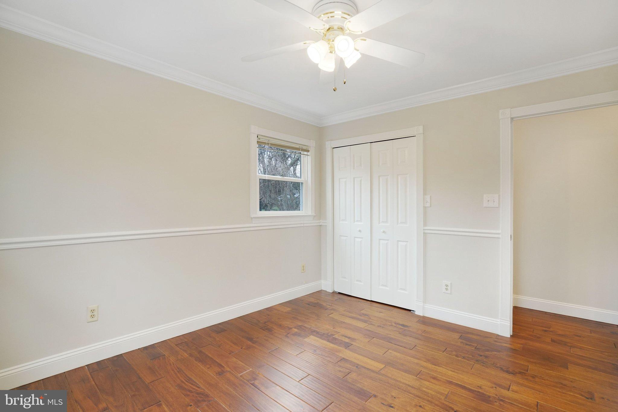 3412 Knox Road Annandale, VA 22003 - Photo 27 of 54 a view of a livingroom with wooden floor and a ceiling fan