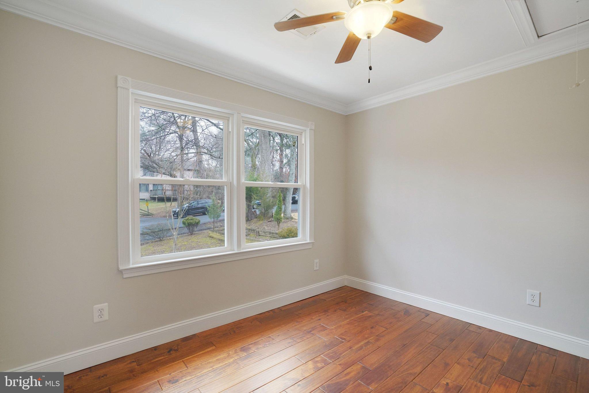 3412 Knox Road Annandale, VA 22003 - Photo 30 of 54 a view of an empty room with wooden floor and a window