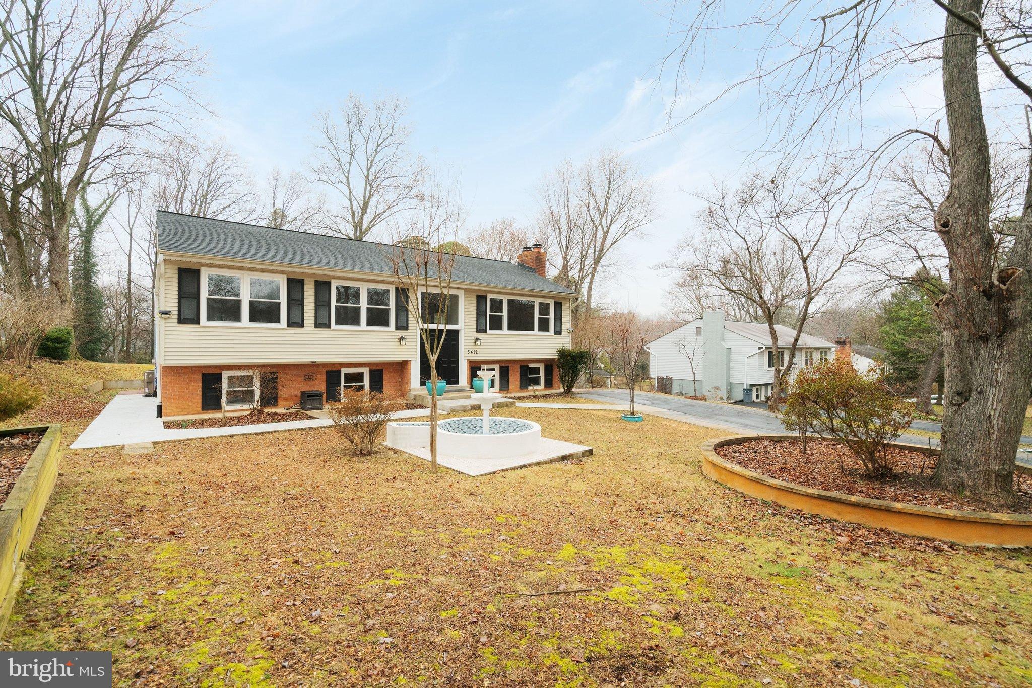 3412 Knox Road Annandale, VA 22003 - Photo 3 of 54 a front view of a house with a yard and trees