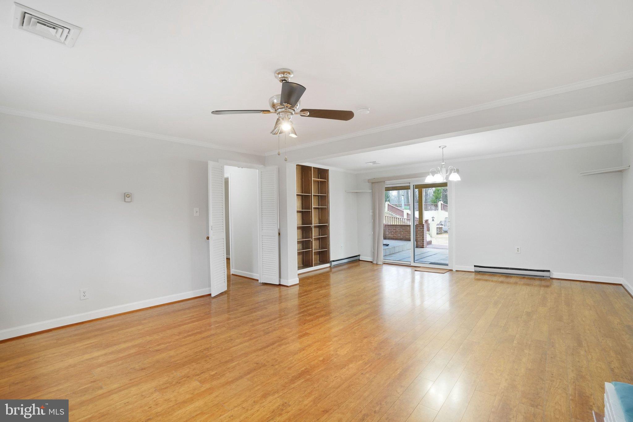 3412 Knox Road Annandale, VA 22003 - Photo 32 of 54 a view of an empty room with wooden floor and a ceiling fan
