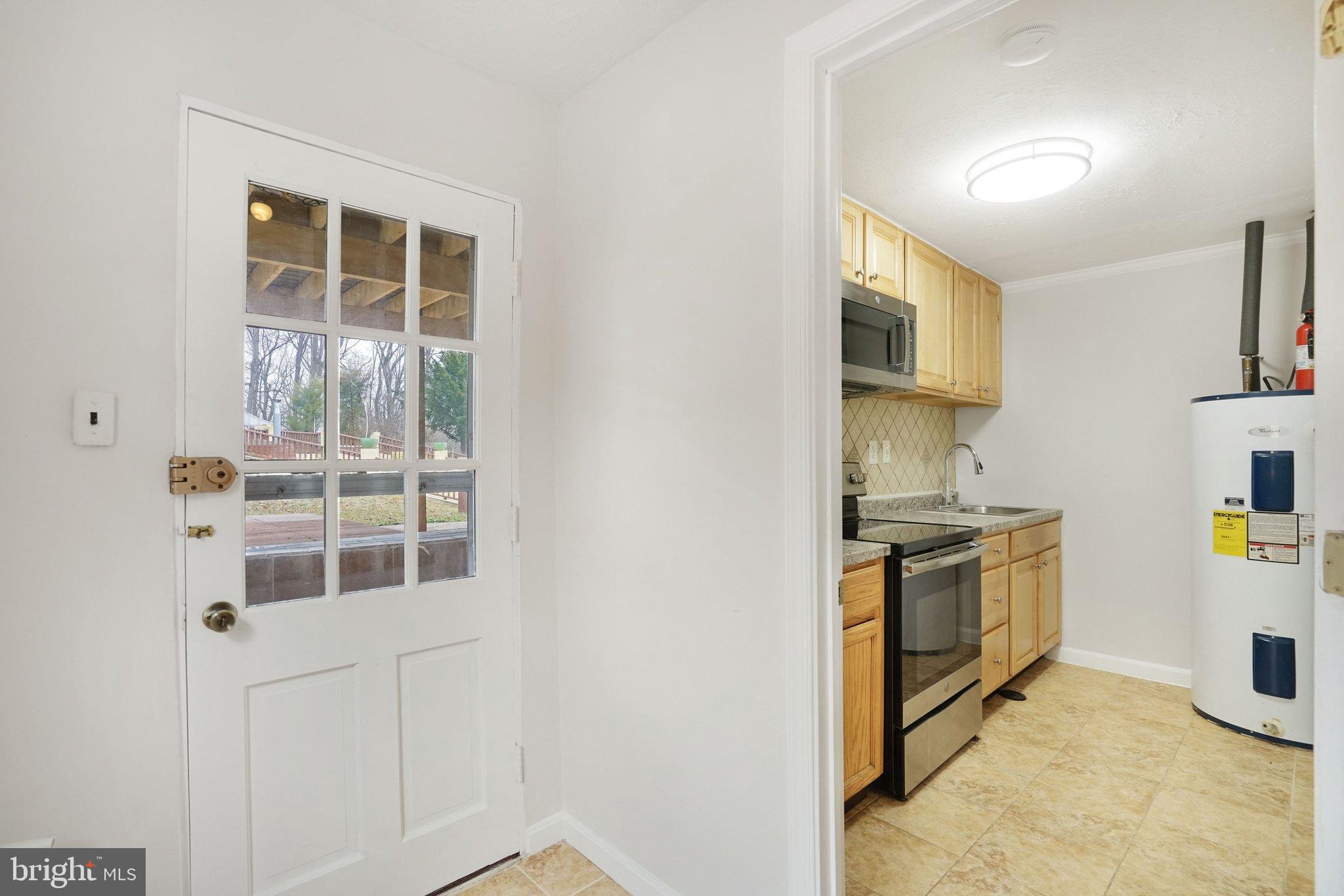 3412 Knox Road Annandale, VA 22003 - Photo 41 of 54 a kitchen with stainless steel appliances granite countertop a stove and a sink