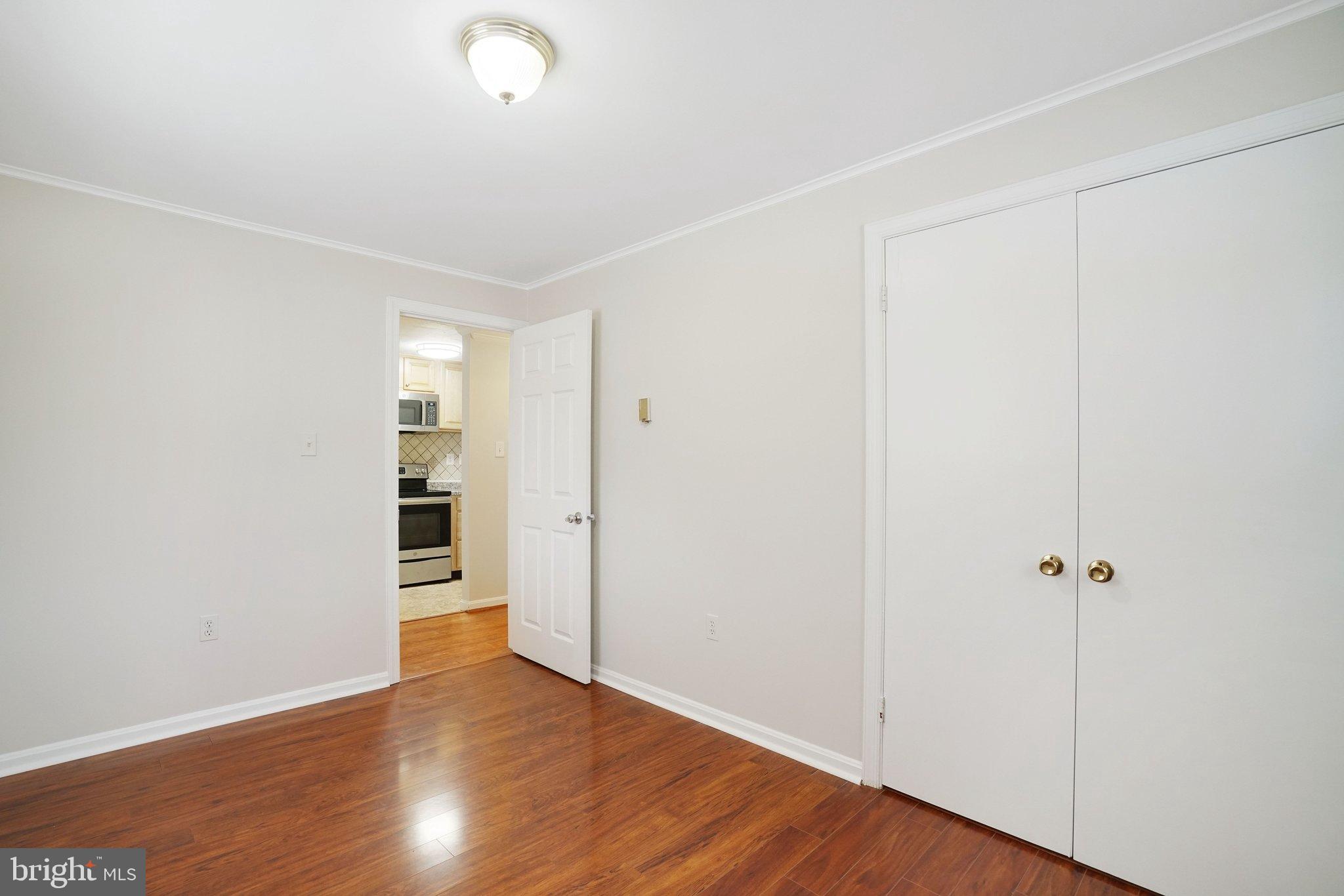3412 Knox Road Annandale, VA 22003 - Photo 44 of 54 an empty room with wooden floor and closet