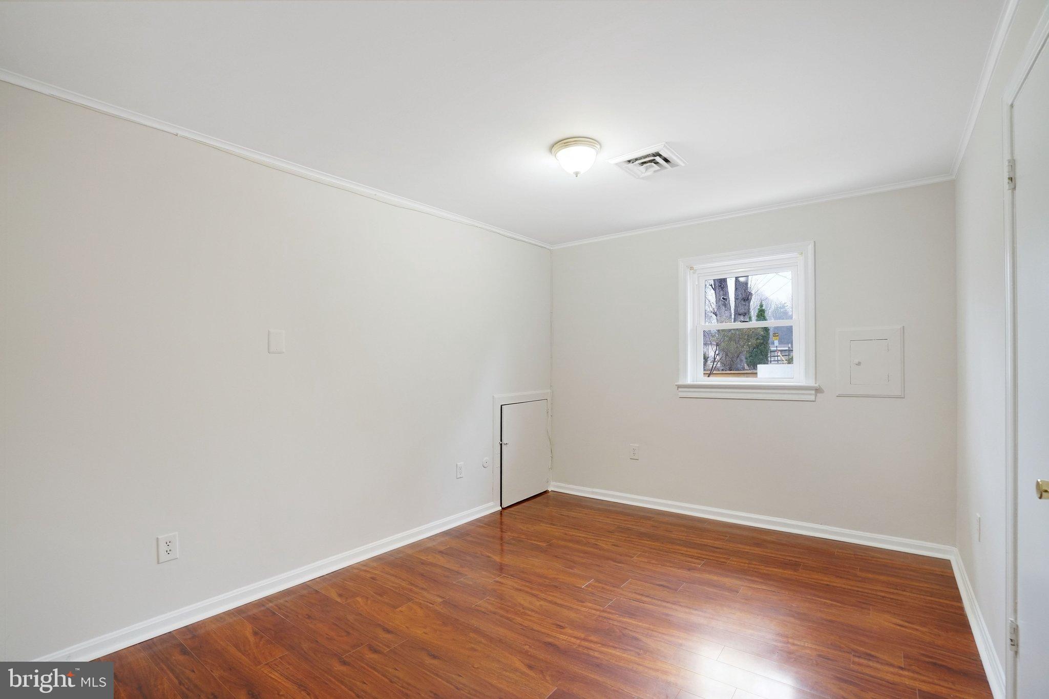3412 Knox Road Annandale, VA 22003 - Photo 45 of 54 a view of empty room with wooden floor and fan