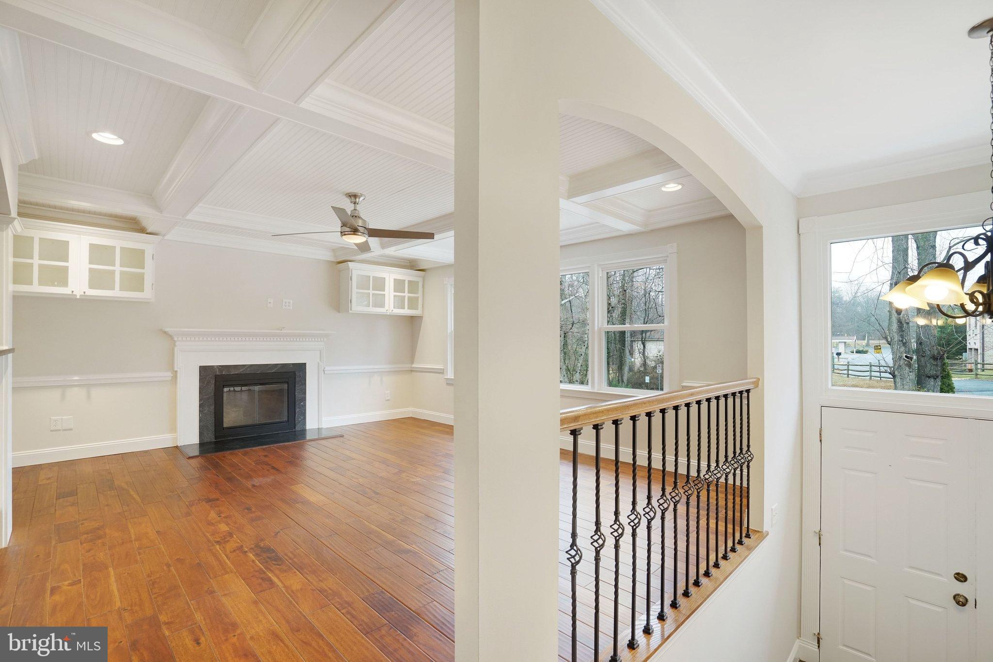 3412 Knox Road Annandale, VA 22003 - Photo 5 of 54 an empty room with wooden floor fireplace and windows