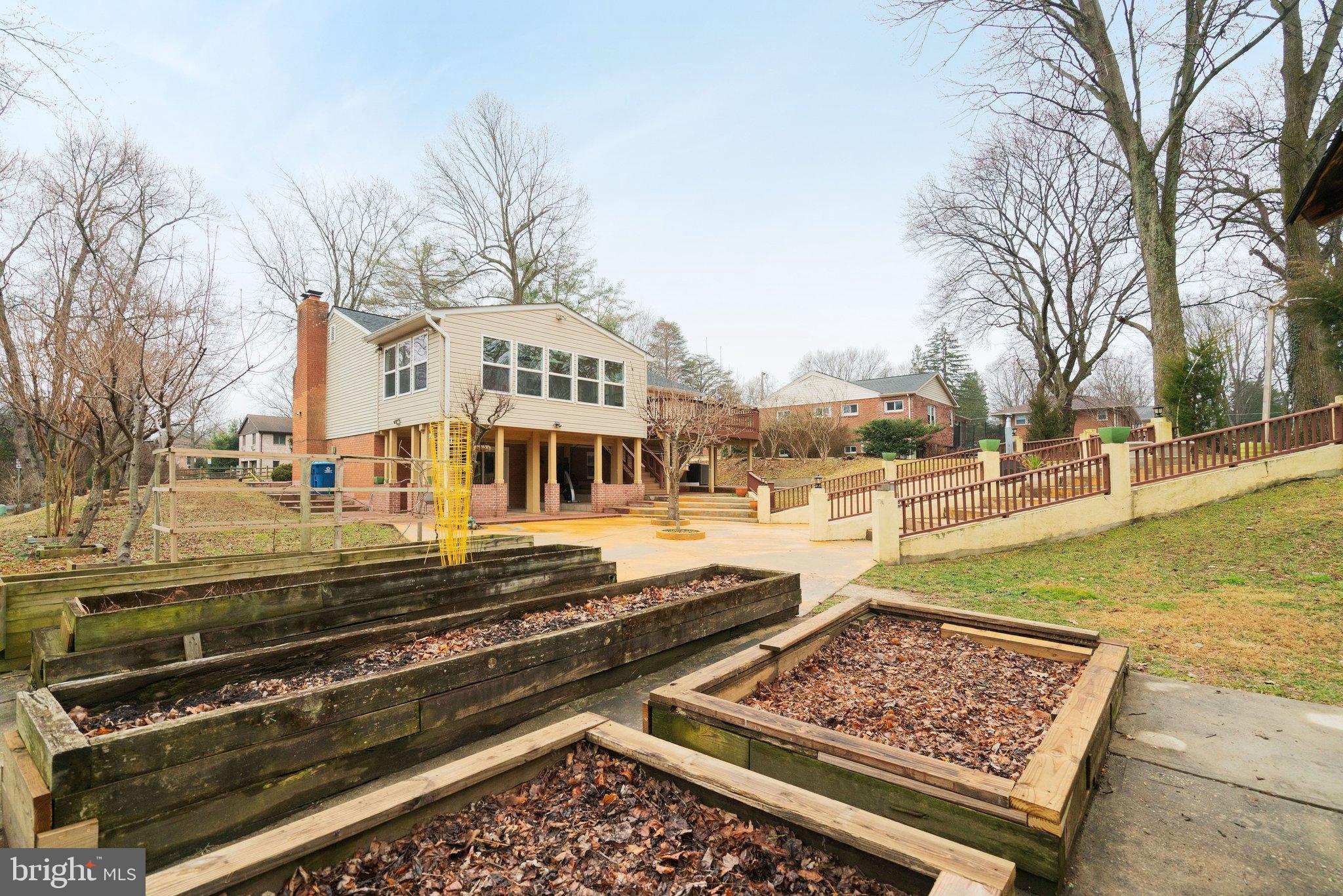 3412 Knox Road Annandale, VA 22003 - Photo 51 of 54 a view of a swimming pool with a lawn chairs under an umbrella