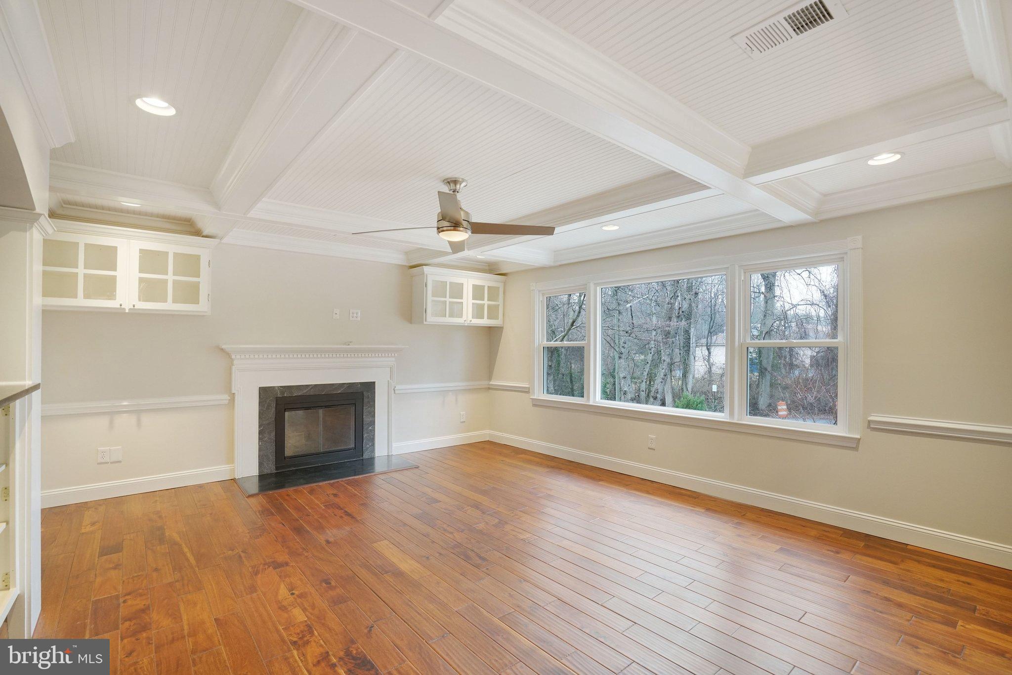 3412 Knox Road Annandale, VA 22003 - Photo 6 of 54 an empty room with wooden floor fireplace and windows