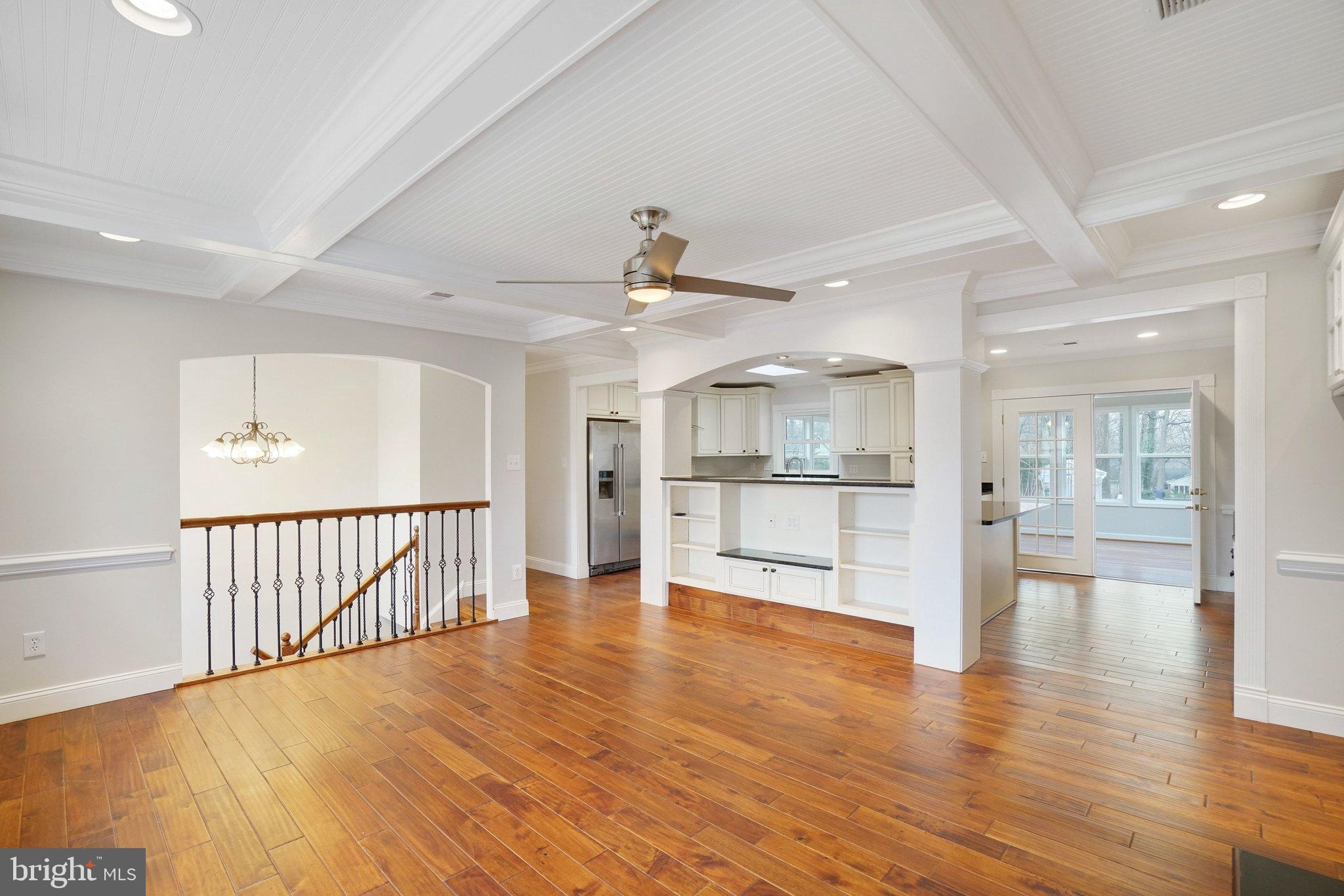 3412 Knox Road Annandale, VA 22003 - Photo 8 of 54 a view of an empty room with wooden floor and a kitchen
