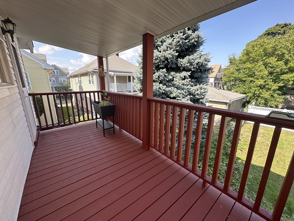 17 Herbert Road, Unit 1 Arlington, MA 02474 - Photo 5 of 26 a view of balcony with wooden floor