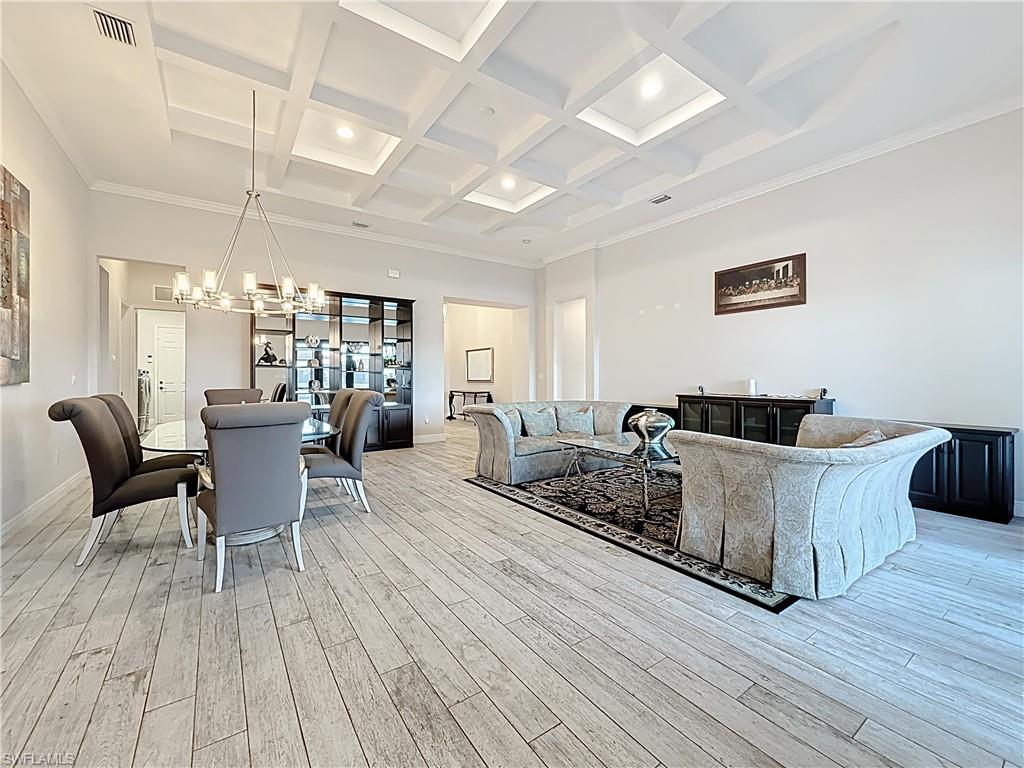 5550 Ferrari Avenue Ave Maria, FL 34142 - Photo 13 of 50 a living room with furniture and wooden floor