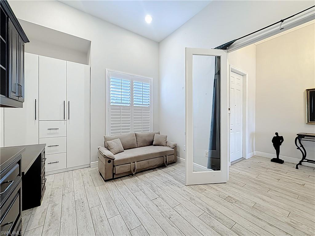 5550 Ferrari Avenue Ave Maria, FL 34142 - Photo 15 of 50 a living room with furniture and a wooden floor
