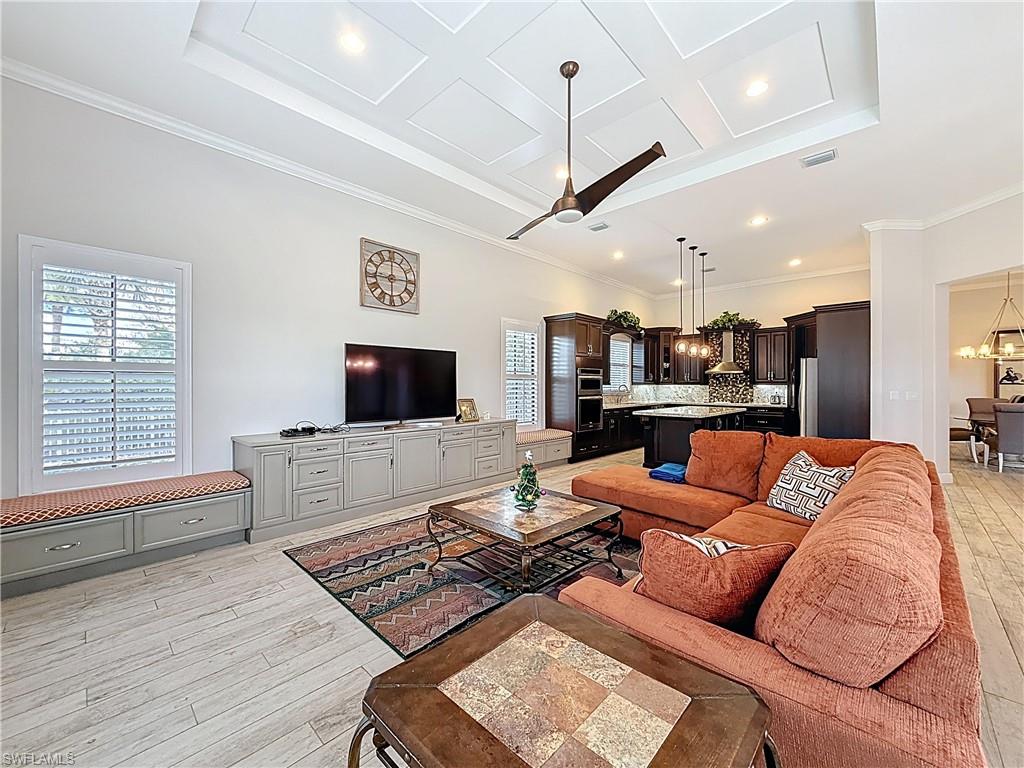 5550 Ferrari Avenue Ave Maria, FL 34142 - Photo 17 of 50 a living room with furniture and a flat screen tv