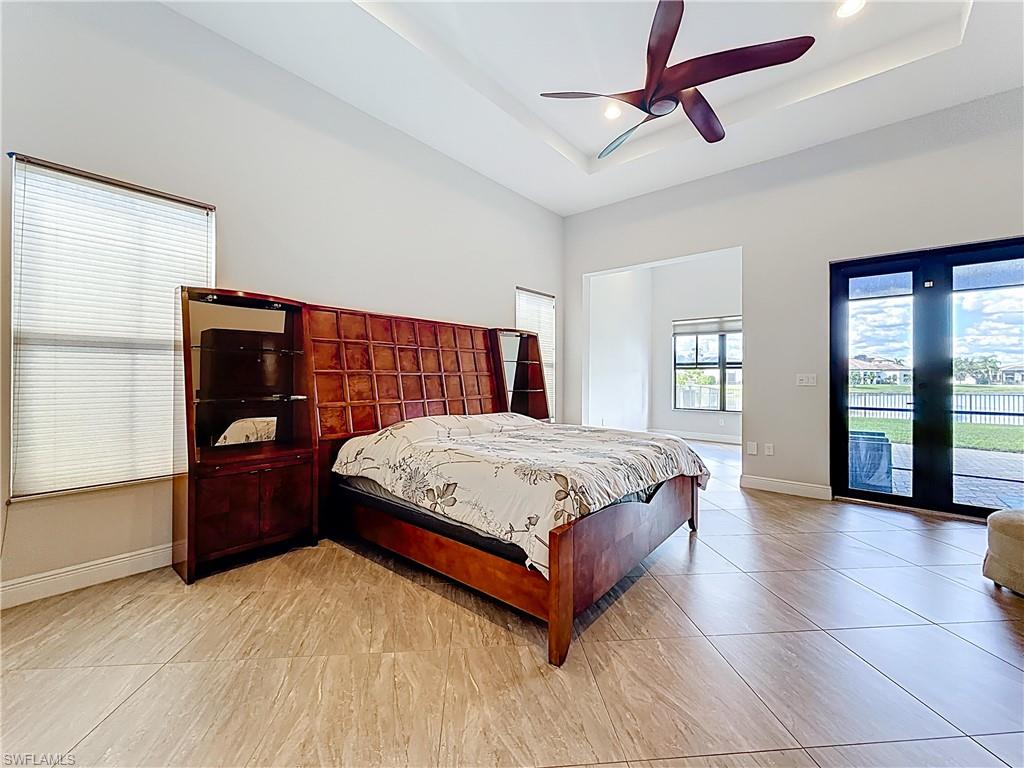 5550 Ferrari Avenue Ave Maria, FL 34142 - Photo 27 of 50 a spacious bedroom with a bed and window