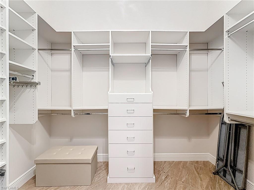 5550 Ferrari Avenue Ave Maria, FL 34142 - Photo 28 of 50 a view of walk in closet with clothes and shoes