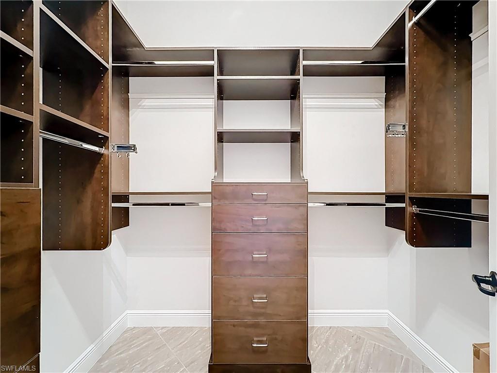 5550 Ferrari Avenue Ave Maria, FL 34142 - Photo 29 of 50 a view of walk in closet with empty racks