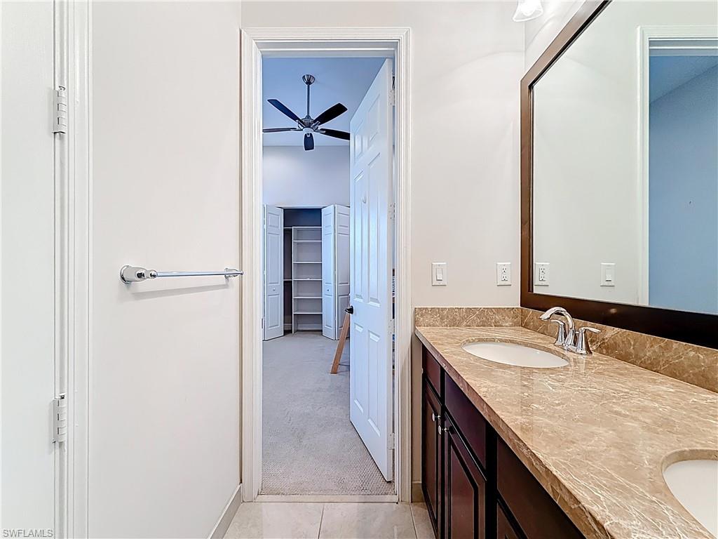 5550 Ferrari Avenue Ave Maria, FL 34142 - Photo 33 of 50 a bathroom with a granite countertop sink and mirror