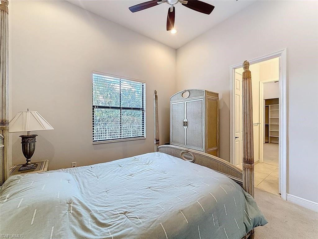 5550 Ferrari Avenue Ave Maria, FL 34142 - Photo 37 of 50 a bedroom with a bed and a window