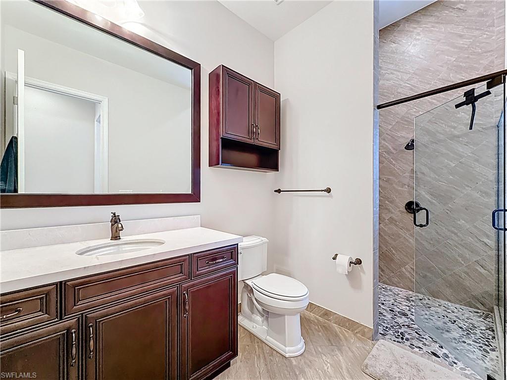 5550 Ferrari Avenue Ave Maria, FL 34142 - Photo 38 of 50 a bathroom with a sink toilet and shower