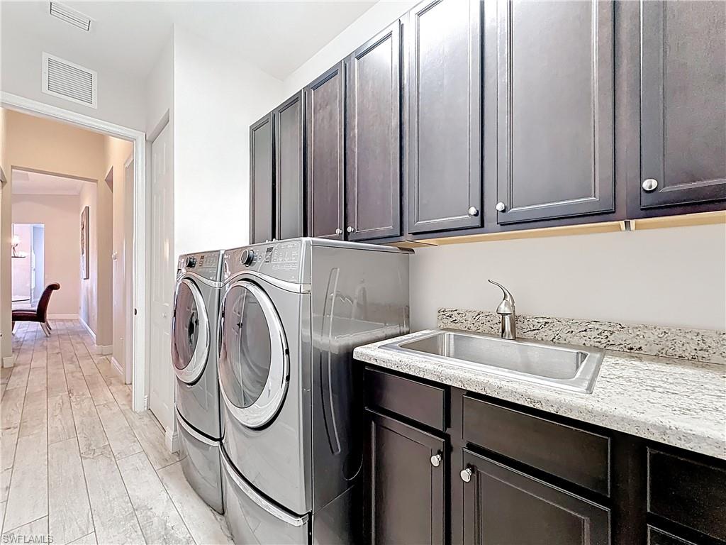 5550 Ferrari Avenue Ave Maria, FL 34142 - Photo 40 of 50 a utility room with dryer and washer