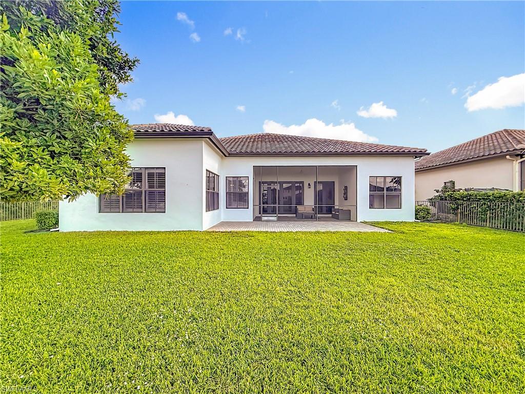 5550 Ferrari Avenue Ave Maria, FL 34142 - Photo 45 of 50 a front view of house with yard and outdoor seating