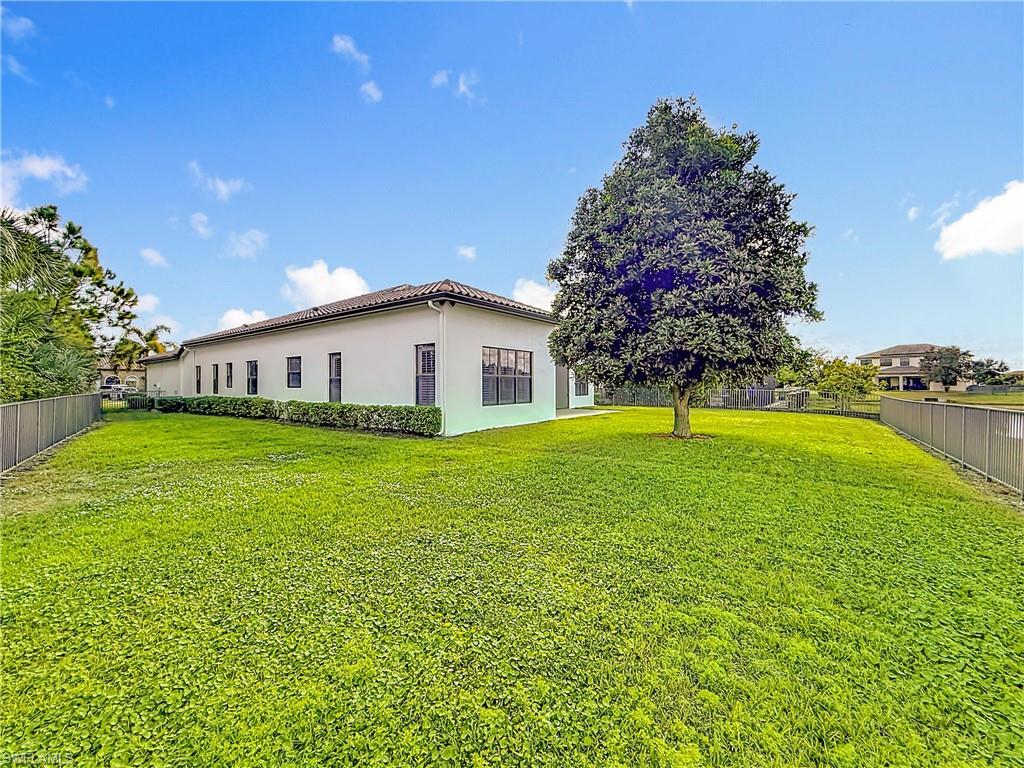 5550 Ferrari Avenue Ave Maria, FL 34142 - Photo 46 of 50 a view of a house with a backyard