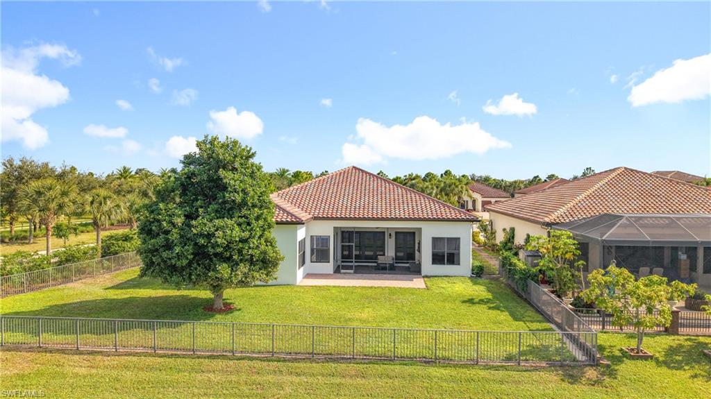 5550 Ferrari Avenue Ave Maria, FL 34142 - Photo 47 of 50 a view of a house with swimming pool and a garden