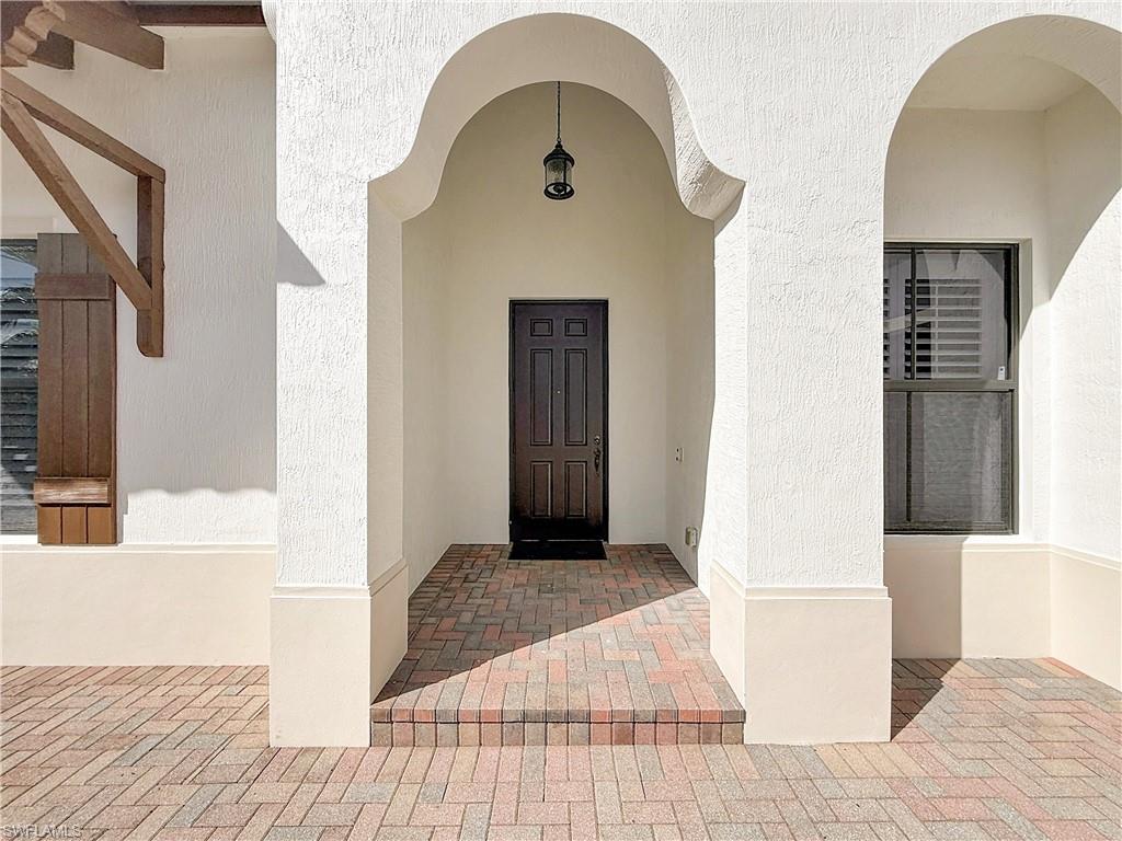 5550 Ferrari Avenue Ave Maria, FL 34142 - Photo 5 of 50 a picture of a bedroom with wooden floor and a bathroom