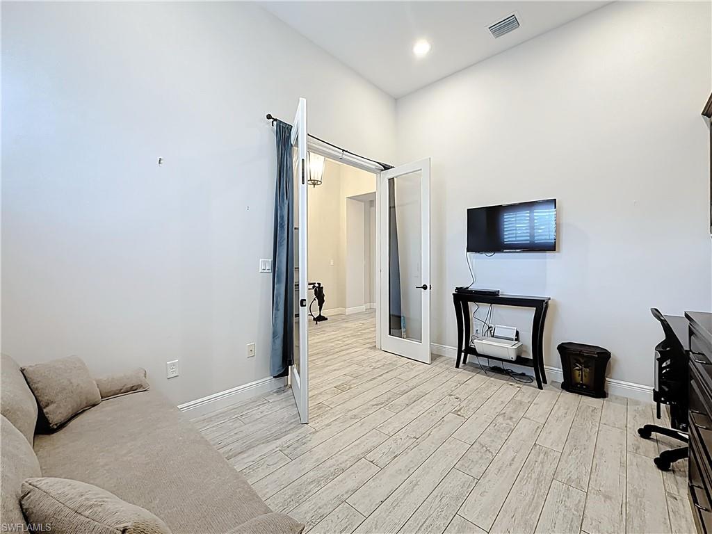 5550 Ferrari Avenue Ave Maria, FL 34142 - Photo 7 of 50 a bedroom with a bed and a television