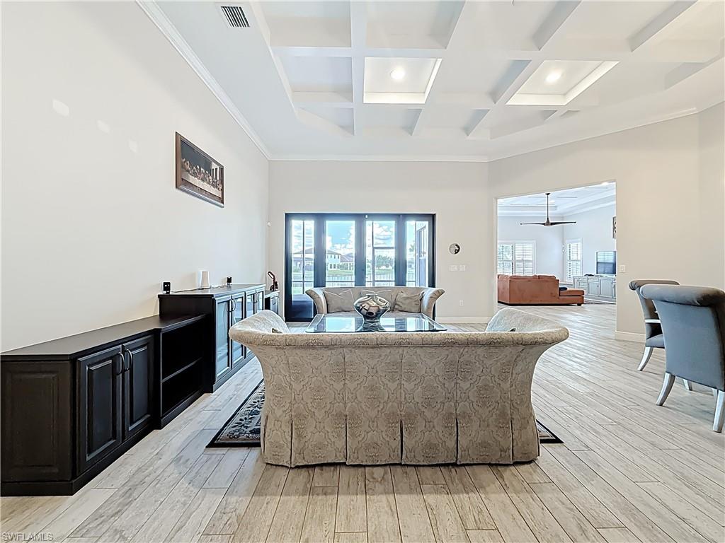 5550 Ferrari Avenue Ave Maria, FL 34142 - Photo 9 of 50 a living room with furniture and wooden floor