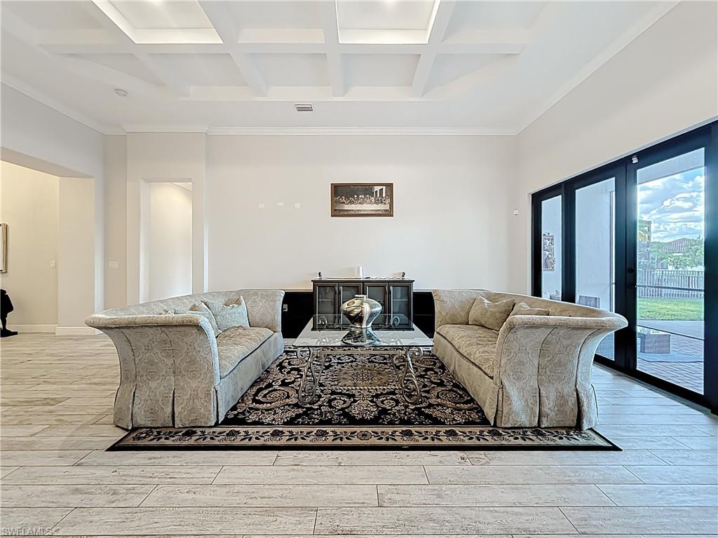 5550 Ferrari Avenue Ave Maria, FL 34142 - Photo 10 of 50 a living room with furniture a wooden floor and window