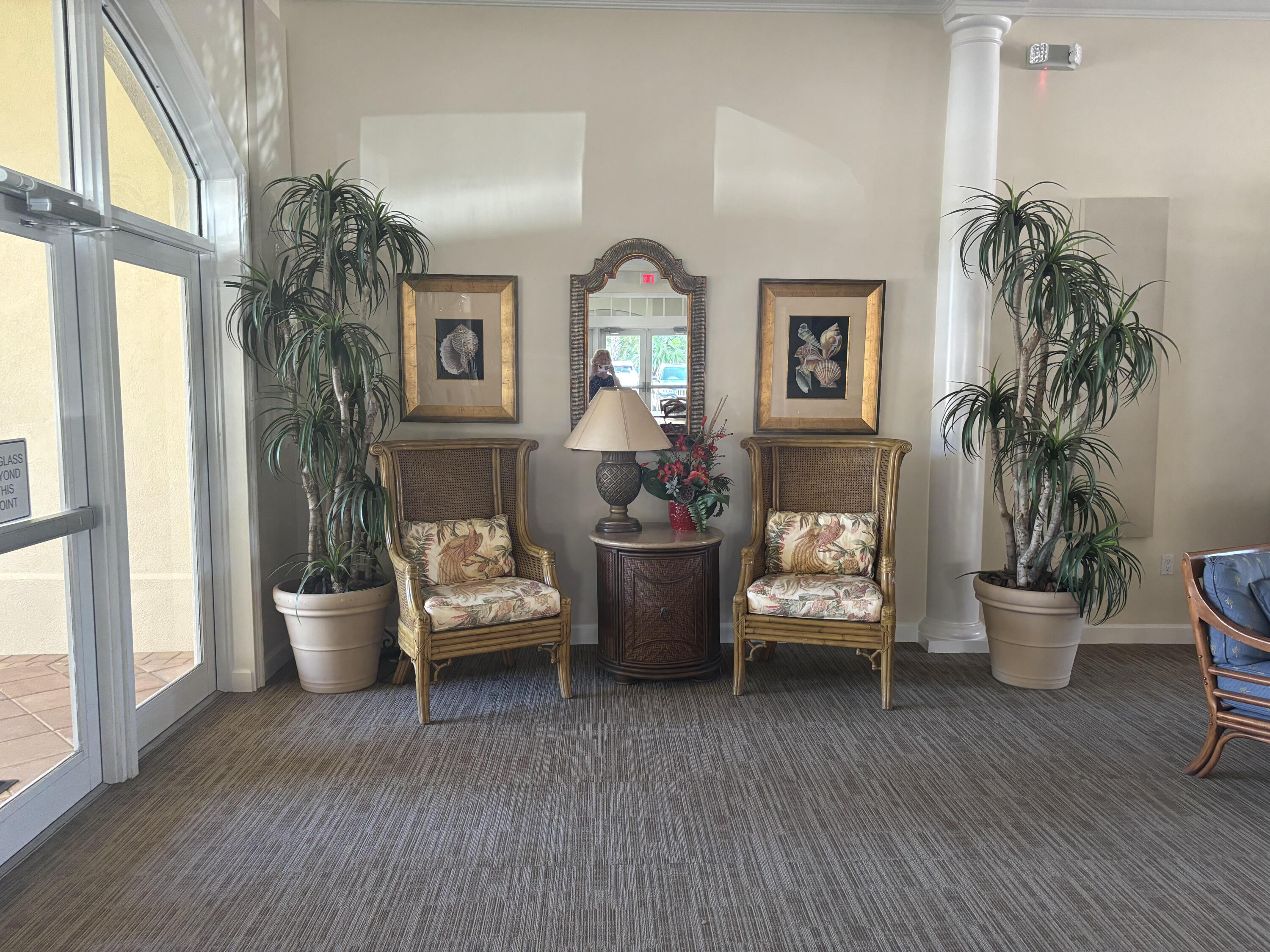 10 Harbour Isle Drive East, Unit 303 Fort Pierce, FL 34949 - Photo 26 of 31 a living room with furniture and a potted plant