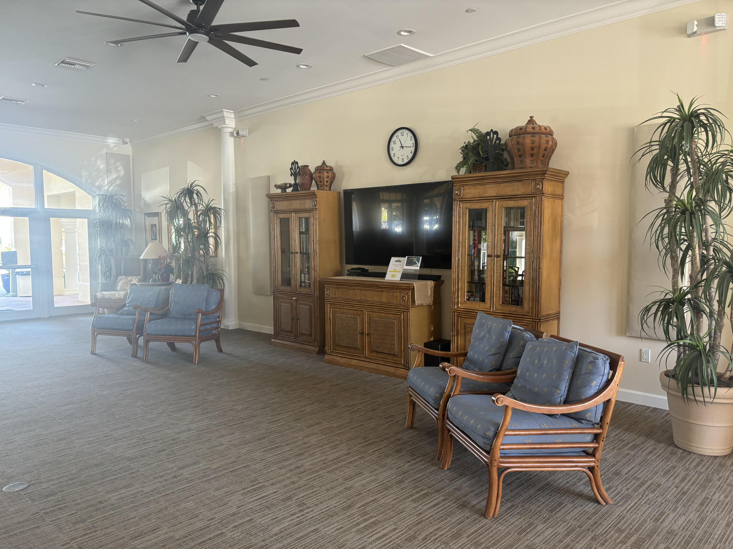 10 Harbour Isle Drive East, Unit 303 Fort Pierce, FL 34949 - Photo 30 of 31 a living room with furniture and a flat screen tv