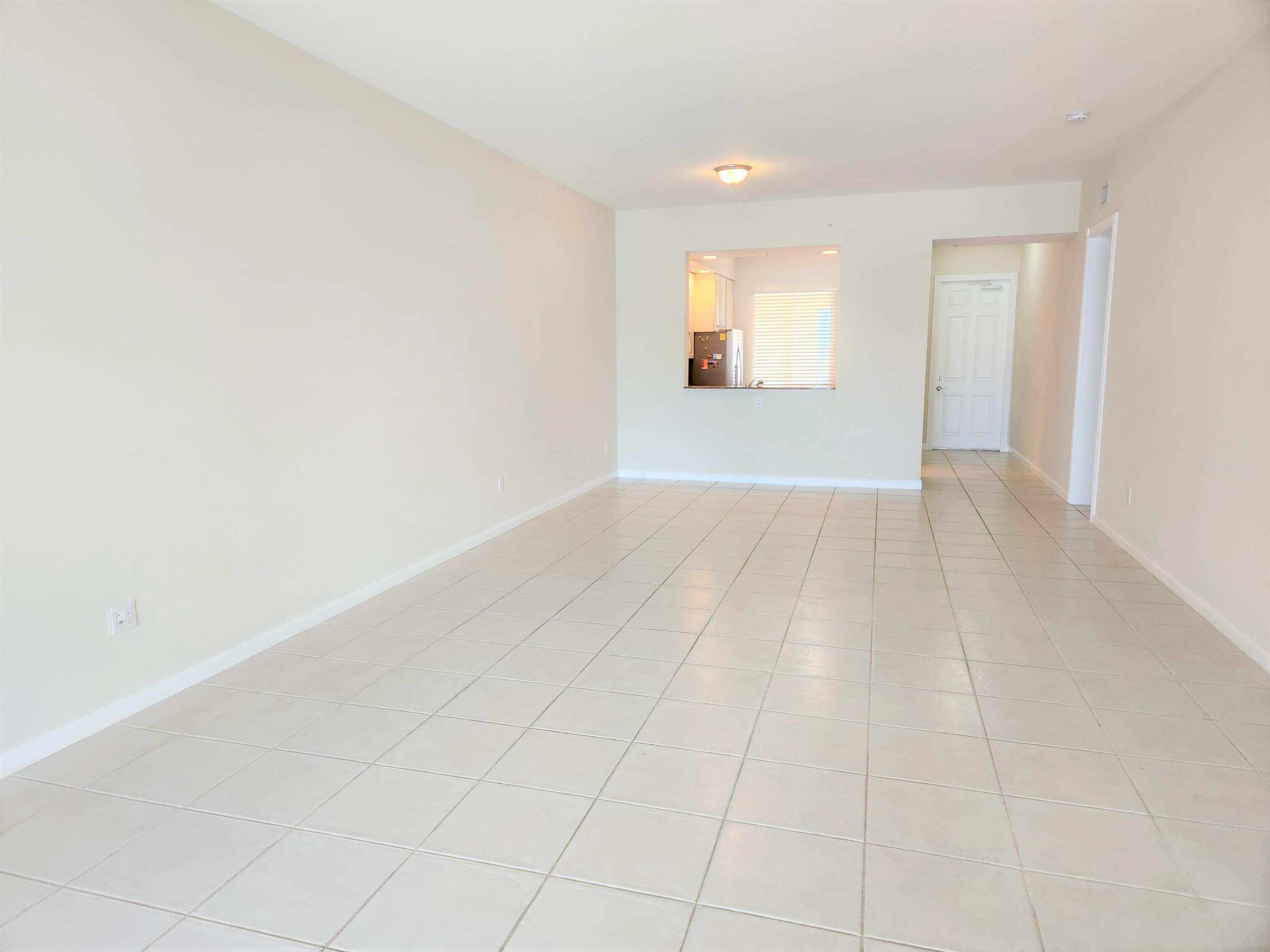 10 Harbour Isle Drive East, Unit 303 Fort Pierce, FL 34949 - Photo 5 of 31 an empty room with windows