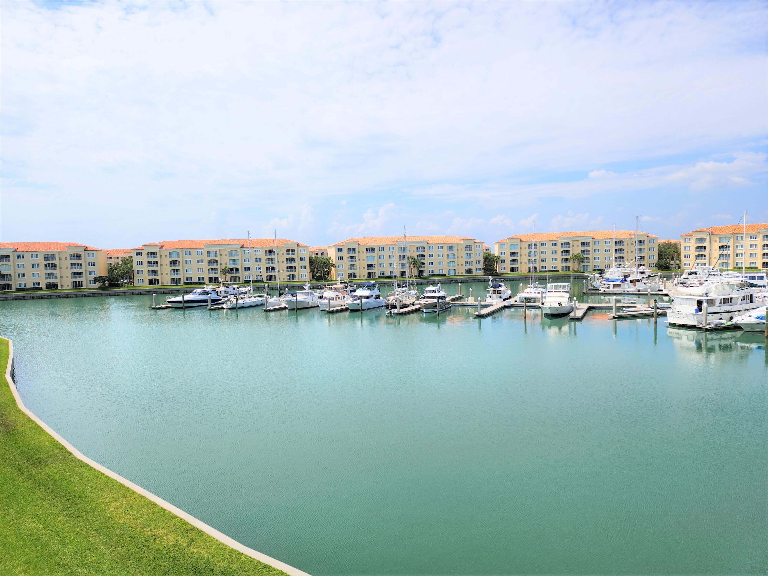 10 Harbour Isle Drive East, Unit 303 Fort Pierce, FL 34949 - Photo 8 of 31 a view of a lake with houses