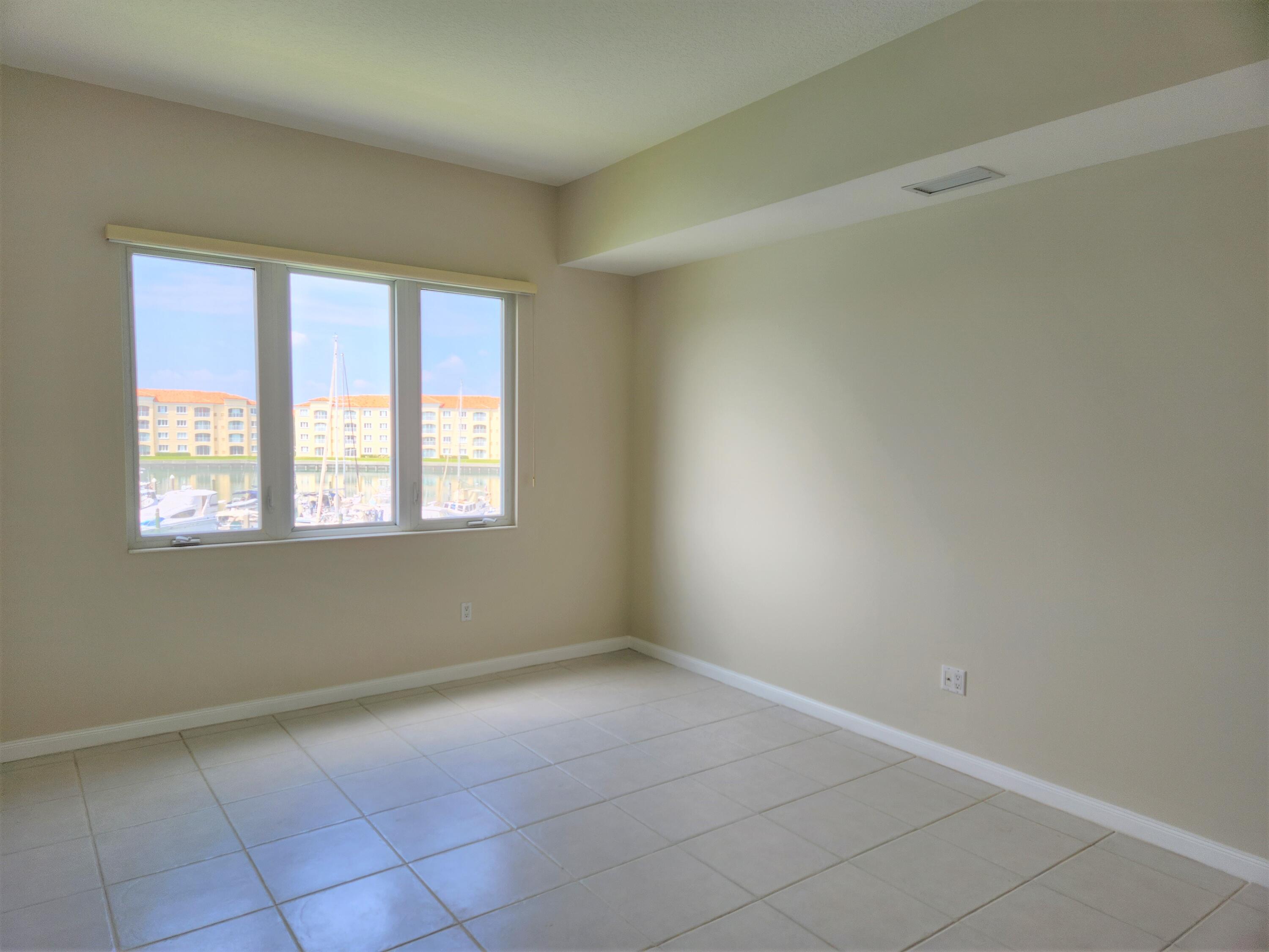 10 Harbour Isle Drive East, Unit 303 Fort Pierce, FL 34949 - Photo 10 of 31 an empty room with windows
