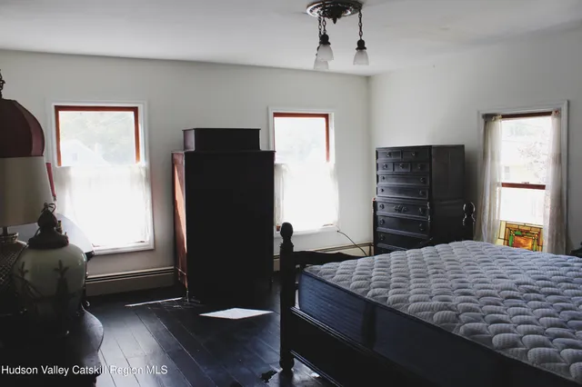 a bathroom with a toilet a sink and a window