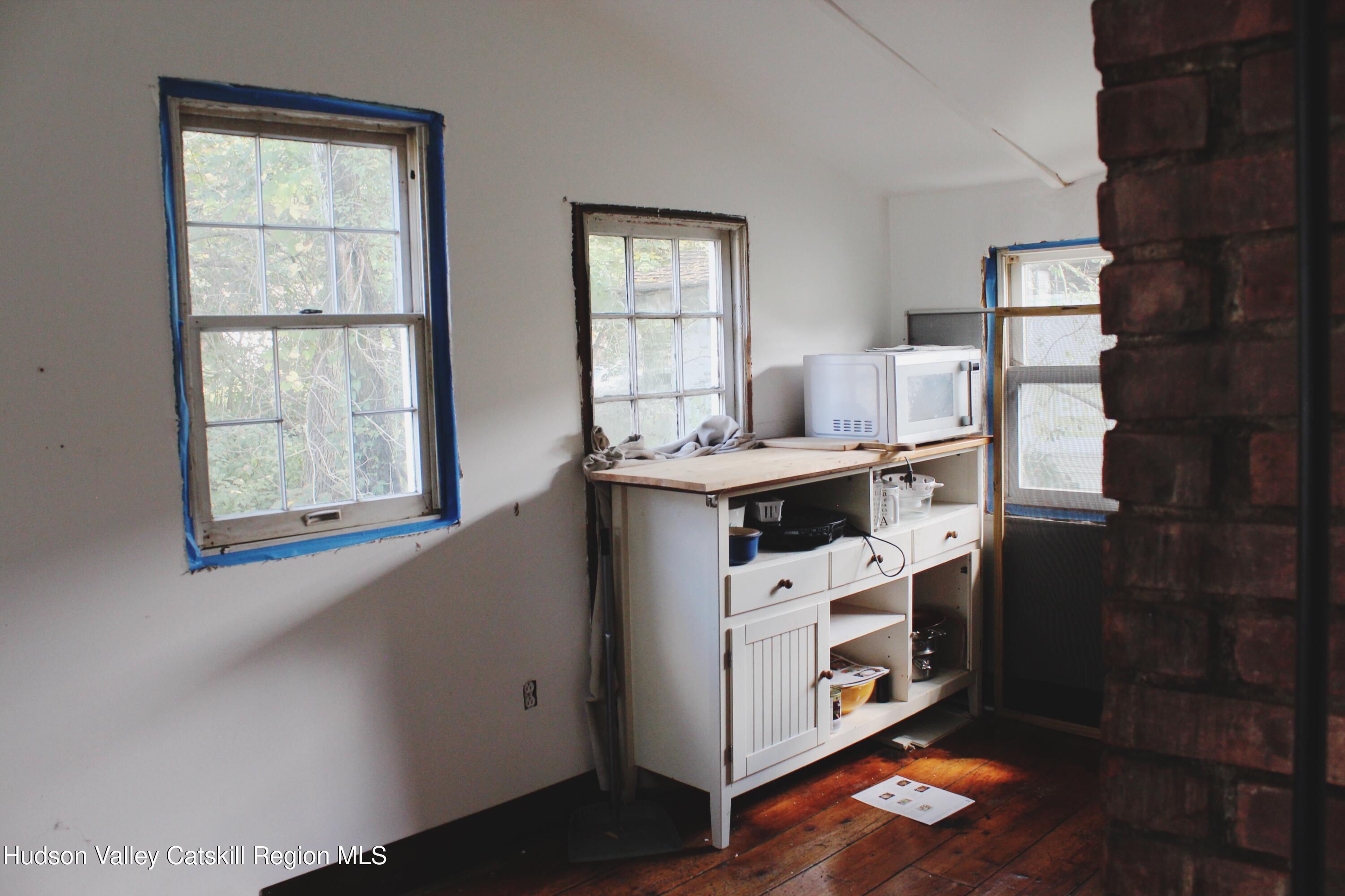 564 Main Street Cairo, NY 12413 - Photo 17 of 27 a utility room with cabinets washer and dryer