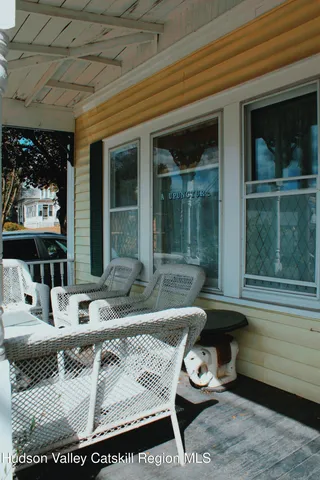 a bathroom with a sink a toilet and a window