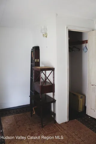 a view of bathroom with a glass door and a window