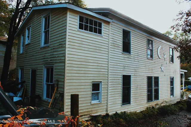 a front view of a house with garage
