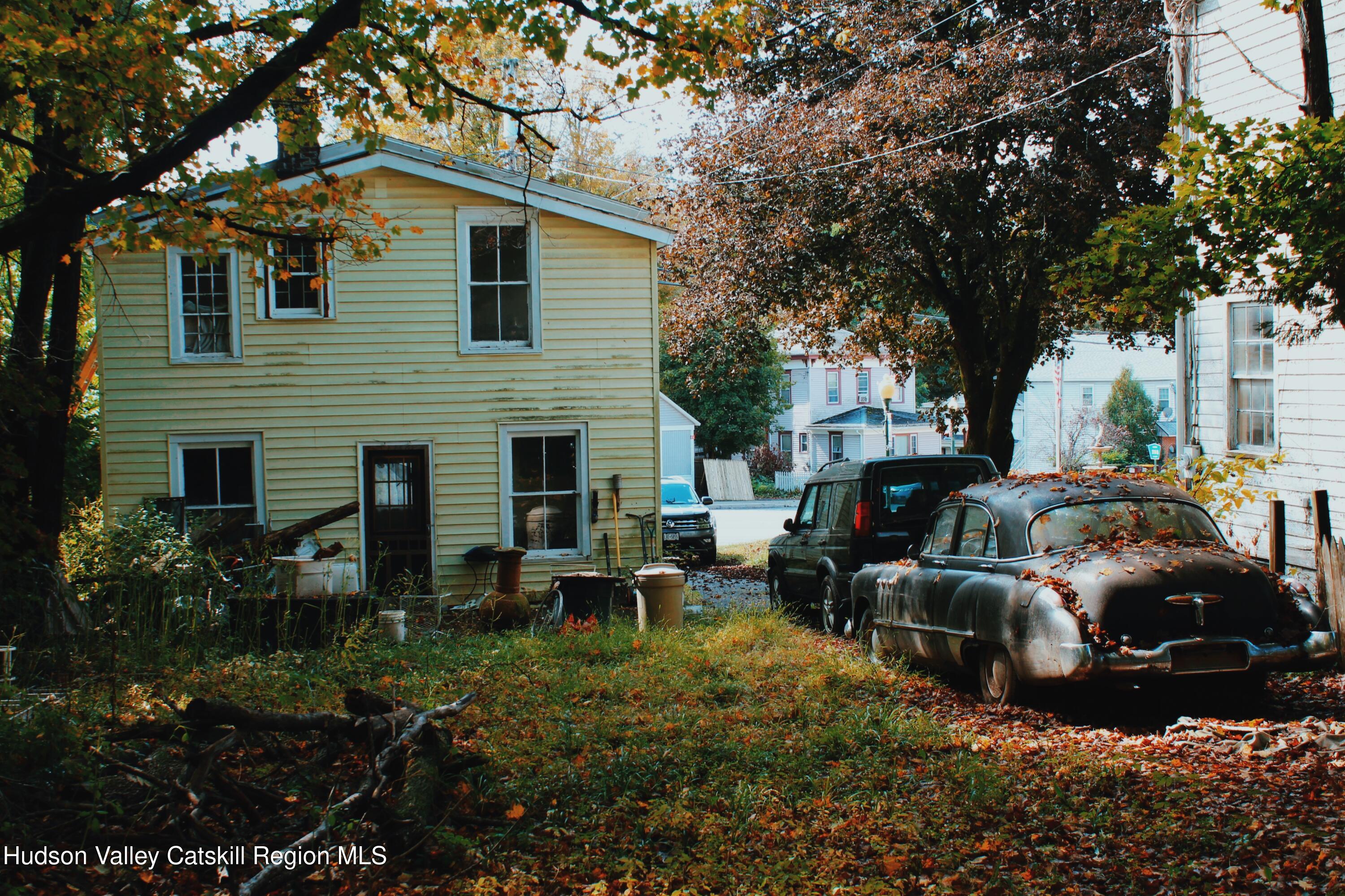 564 Main Street Cairo, NY 12413 - Photo 3 of 27 a view of a house with a yard patio and fire pit