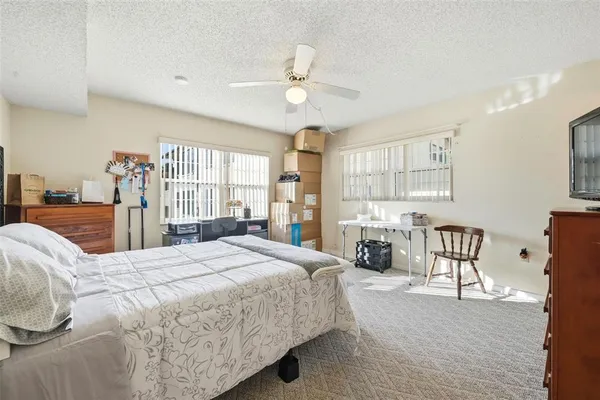 a bedroom with a bed and furniture