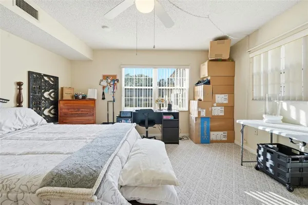 a bathroom with a sink toilet vanity and shower